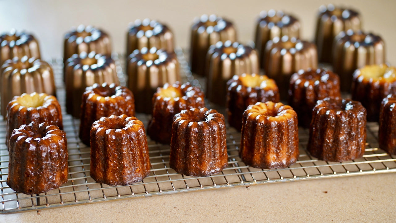 delicious cannele cannelé on a grid